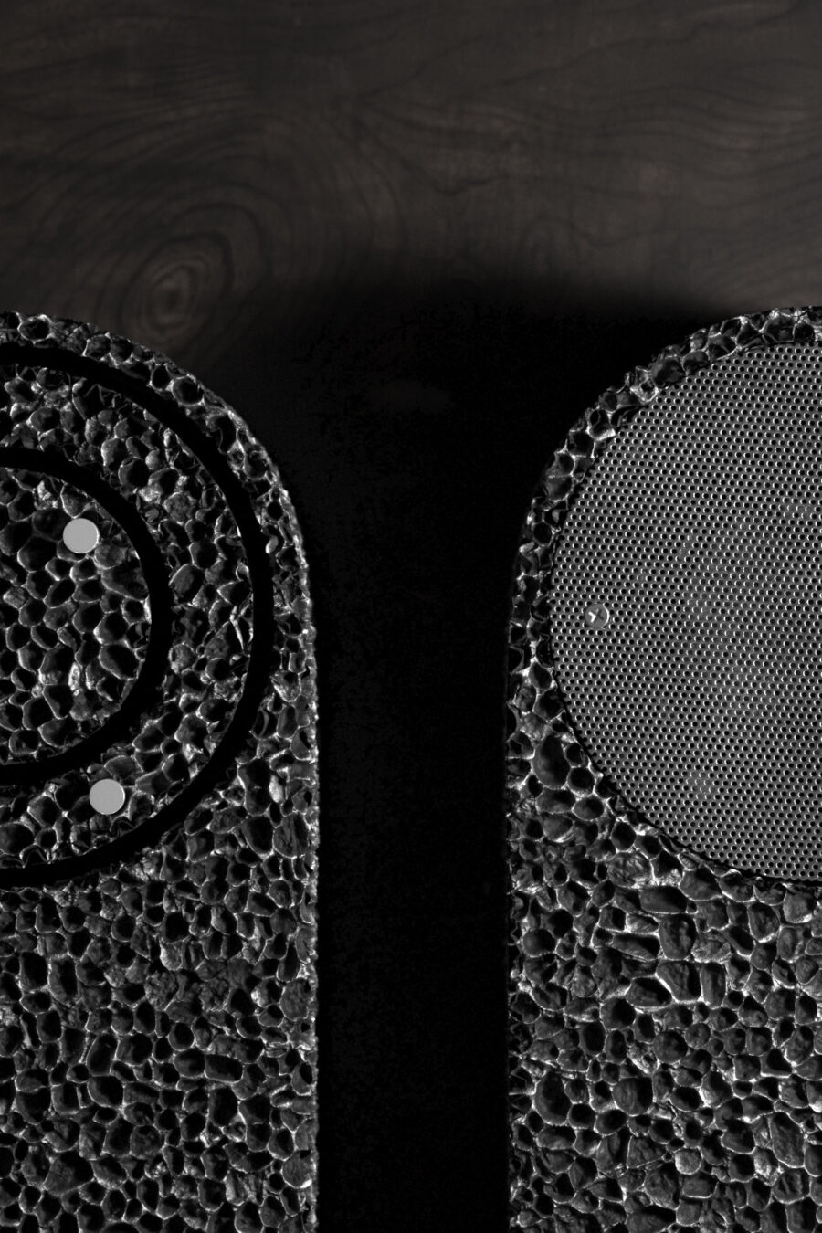 Closeup of front and back of From Foam to dust Table Clock on a wooden shelf.